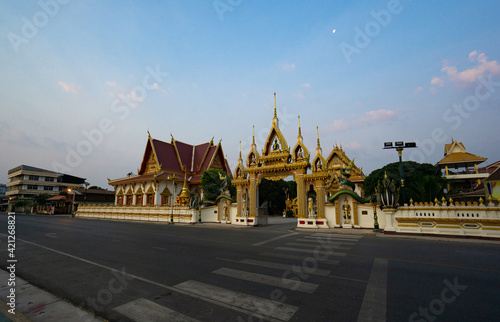 Nakhon Phanom, Thailand - February 12, 2020; Street view of Entrance of Wat Phra In Plaeng temple at dawn