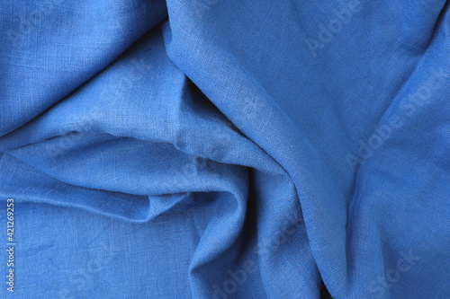 Blue fabric top view with wave curve flowing looking luxurious for backdrop.