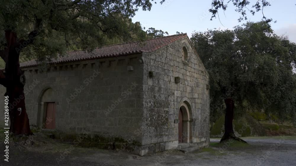 Landscape view of Sao Pedro chapel with trees and boulders in Monsanto, Portugal Landscape view of Sao Pedro chapel with trees and boulders in Monsanto, Portugal