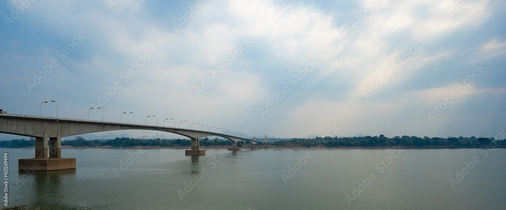 Third Thai–Lao Friendship Bridge, is a bridge over Mekong river that connects Nakhon Phanom Province in Thailand with Thakhek, Khammouane in Laos in cloudy blue sky day