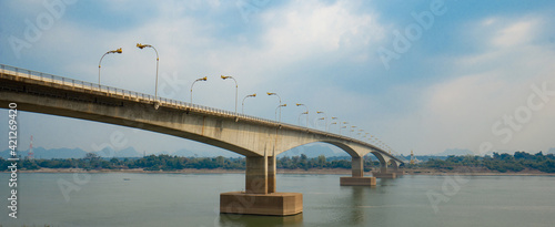 Third Thai–Lao Friendship Bridge, is a bridge over Mekong river that connects Nakhon Phanom Province in Thailand with Thakhek, Khammouane in Laos in cloudy blue sky day