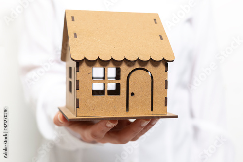 Model house in hand. Real estate concept.