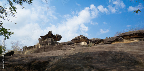 Phu Pha Thoep National Park a small protected area in Mukdahan Province east of Thailand near the border to Laos with cloudy blue sky background photo