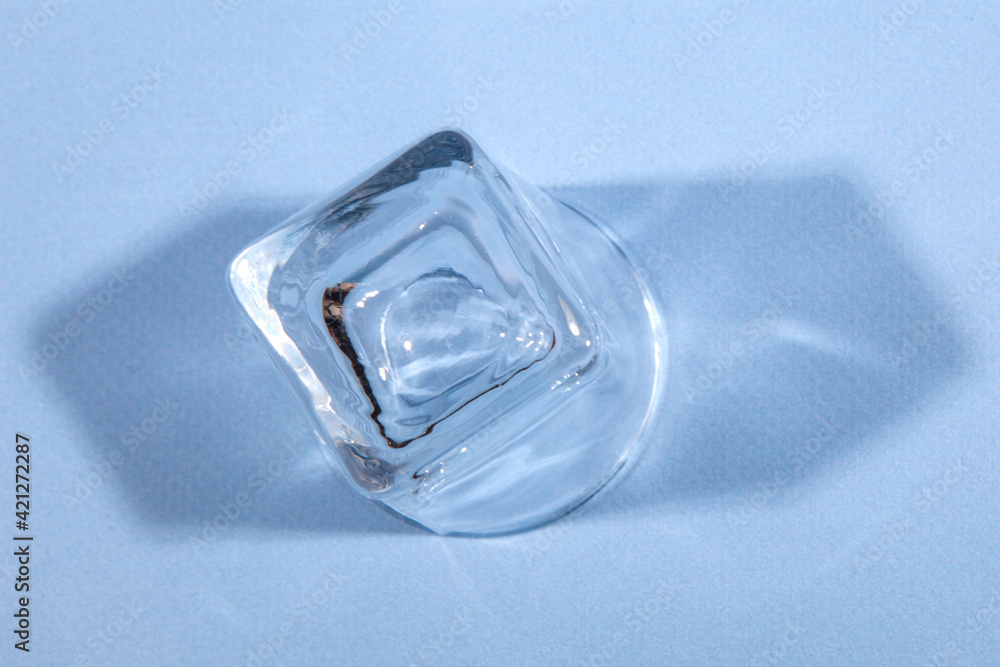 Empty inverted glass on blue background. Studio photo Empty inverted glass on blue background. Studio photo