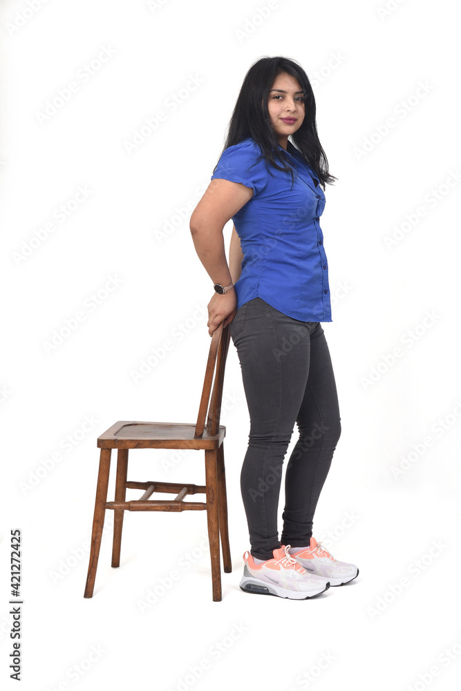 woman playing with a chair in white background, front view, woman playing with a chair in white background, front view,