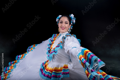 Latin woman dressed in a dress from Jalisco Mexico,