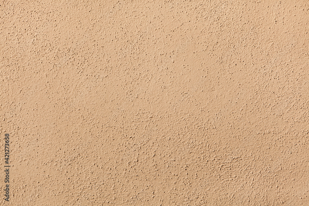 Beige painted stucco wall. Background texture Beige painted stucco wall. Background texture