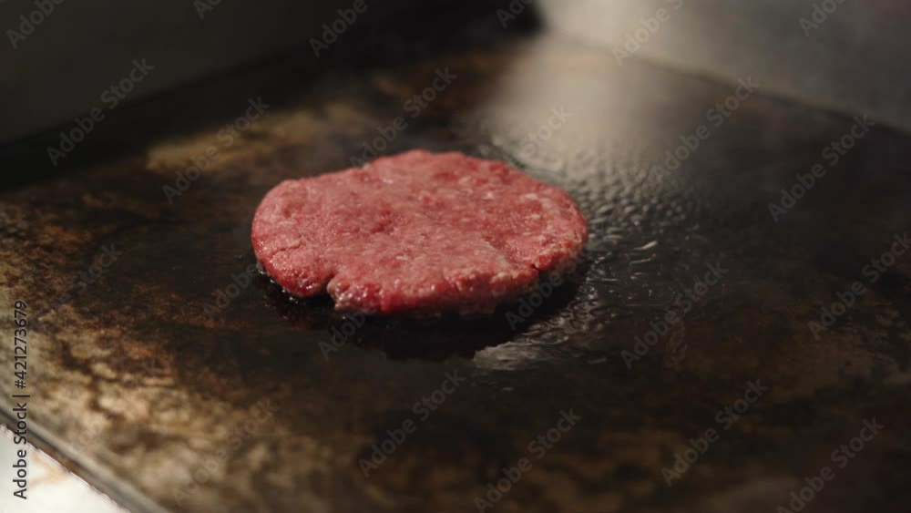 Cooking a beef and pork cutlet for a burger. Meat roasted in the kitchen. Cooking a beef and pork cutlet for a burger. Meat roasted in the kitchen.