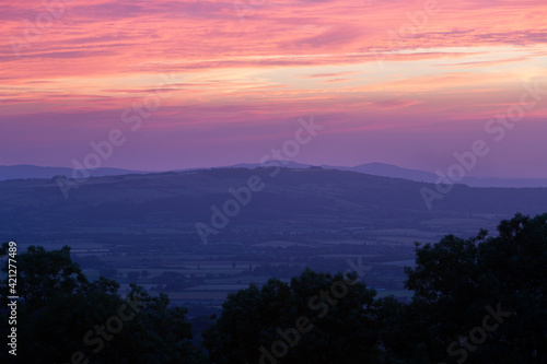 View over the Vale of Evesham and Malvern Hills from Broadway Tower at sunset, Broadway, Cotswolds, Worcestershire, England, United Kingdom, Europe photo