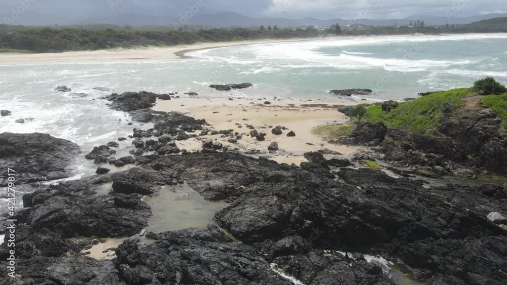 Rocky Coast With Sawtell Beach In Background - Bonville Head Lookout, Sydney, NSW, Australia. - aerial Rocky Coast With Sawtell Beach In Background - Bonville Head Lookout, Sydney, NSW, Australia. - aerial