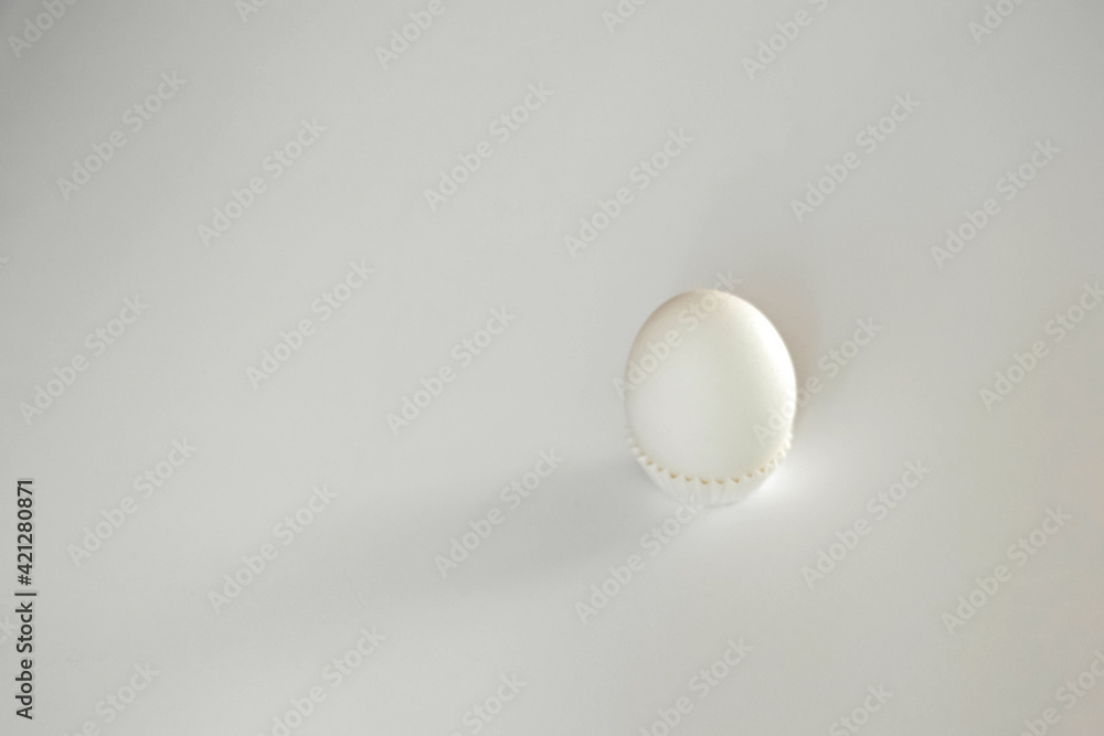 White egg on a white isolated background with shadow. Ingredient.Healthy food.Easter. White egg on a white isolated background with shadow. Ingredient.Healthy food.Easter.