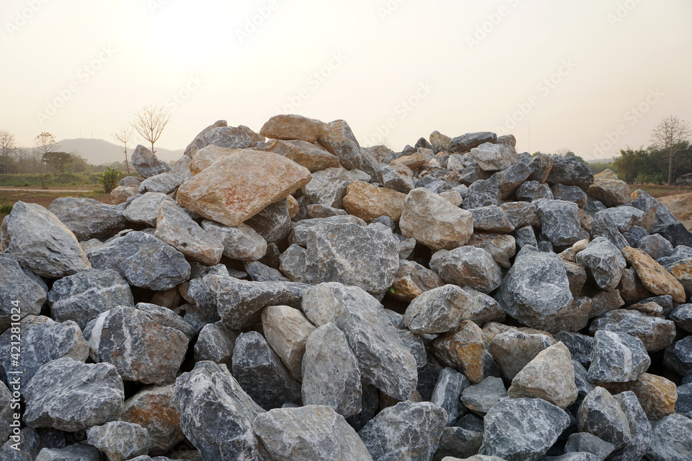Piles of gravel limestone rocks on construction site. Break stones isolated on white background.
Piles of gravel limestone rocks on construction site. Break stones isolated on white background.