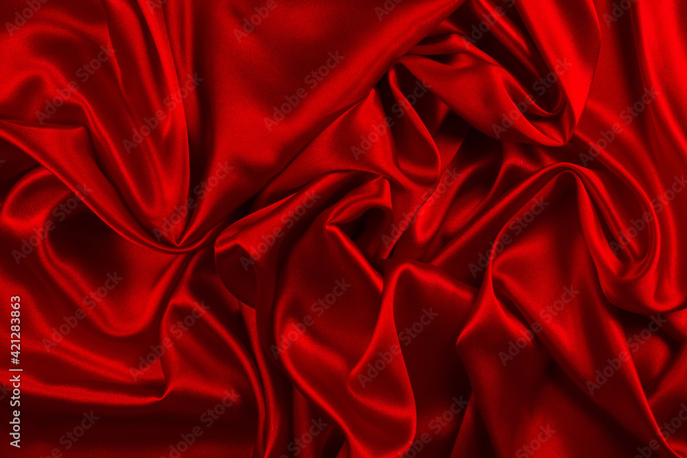 Red silk or satin luxury fabric texture can use as abstract background. Top view. Red silk or satin luxury fabric texture can use as abstract background. Top view.