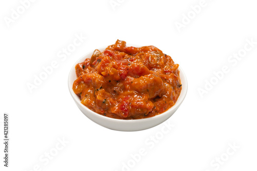 Vegetable stew in a bowl isolated on white background.