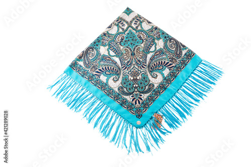 top view flat lay on bright blue cotton scarf with fringe and bright paisley ornament