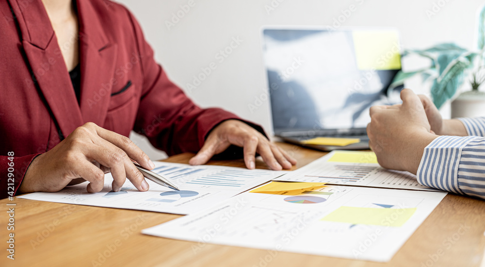 The sales department is having a monthly summary meeting to bring it to the department manager, they are verifying the correctness of the documents that are prepared before bringing in to the manager The sales department is having a monthly summary meeting to bring it to the department manager, they are verifying the correctness of the documents that are prepared before bringing in to the manager