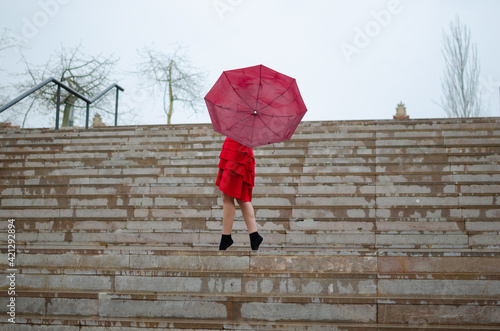 strong wind destroys a woman's umbrella