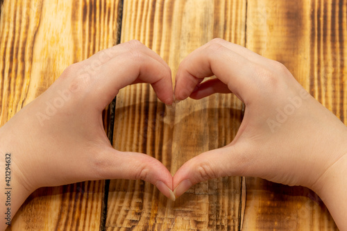 Hands in the shape of a love heart.