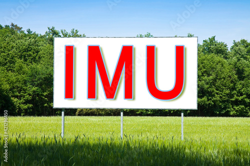 IMU (which means Unique Municipal Tax) the most unpopular italian tax on land and buildings - concept on advertising billboard immersed in a rural scene photo