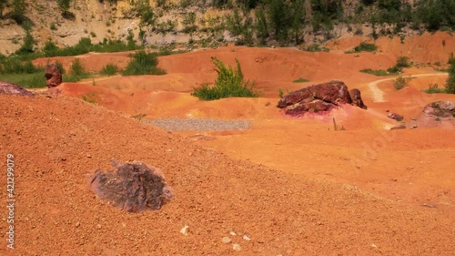 Red stones and rocks in bauxite mine. Gant, Hungary photo