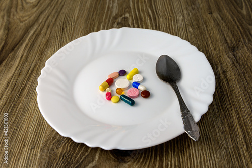 A bunch of pills on a plate