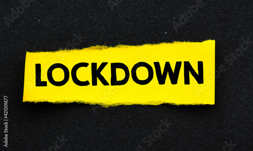 LOCKDOWN written on little yellow paper and a black background.