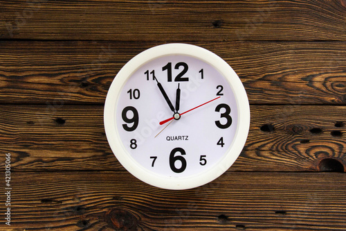 Wallpaper Mural A white clock showing the time on a wooden wall Torontodigital.ca