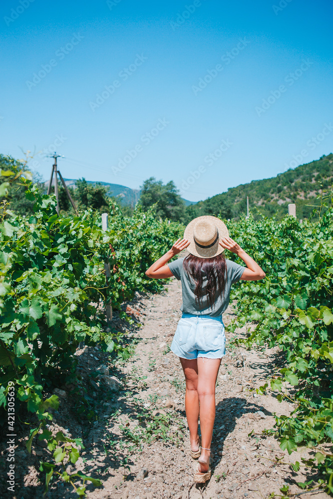Woman in the vineyard in sun day