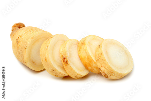 fresh ginseng root slices on white background