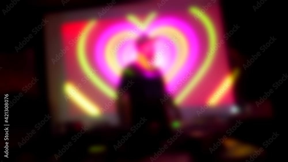 Blurred silhouettes of a Dj at the mixer controller panel. Dancing at party in a night club. Music concert and neon lights. Have fun tonight. Holidays entertainment. Flickering light leaks flashing.
Blurred silhouettes of a Dj at the mixer controller panel. Dancing at party in a night club. Music concert and neon lights. Have fun tonight. Holidays entertainment. Flickering light leaks flashing.