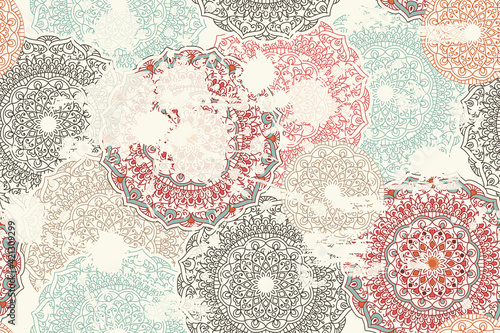 Abstract seamless turkish pattern with blots and an effect of attrition in retro colors. Shabby carpet from mandalas. Vector Background for ceramic tile, wallpaper, linoleum, textile, rug, web page