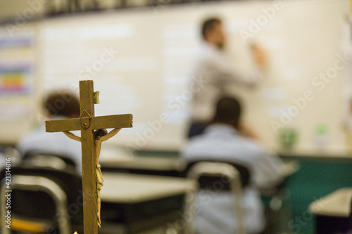 Photo teacher in front of class during Catholic school classroom