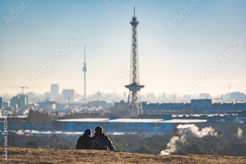 Photography young couple over the city of berlin