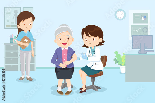 doctor injection vaccine for elderly woman in hospital
