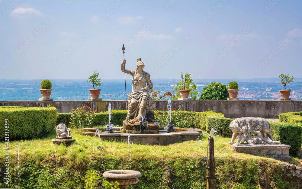 Antique sculptures with fountains in an old italian park