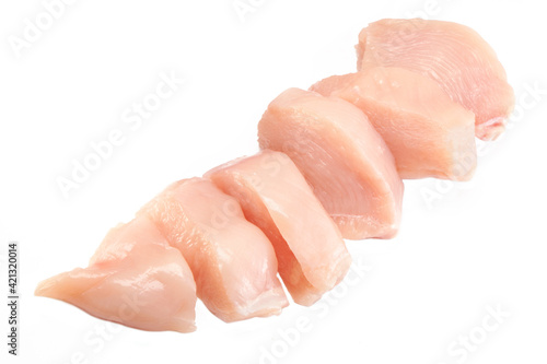 Fresh raw sliced chicken breast fillet isolated closeup on white background, clipping path