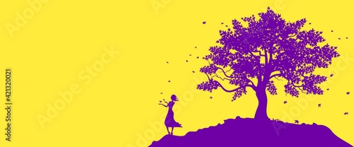 Old big tree and girl on the hill in autumn.