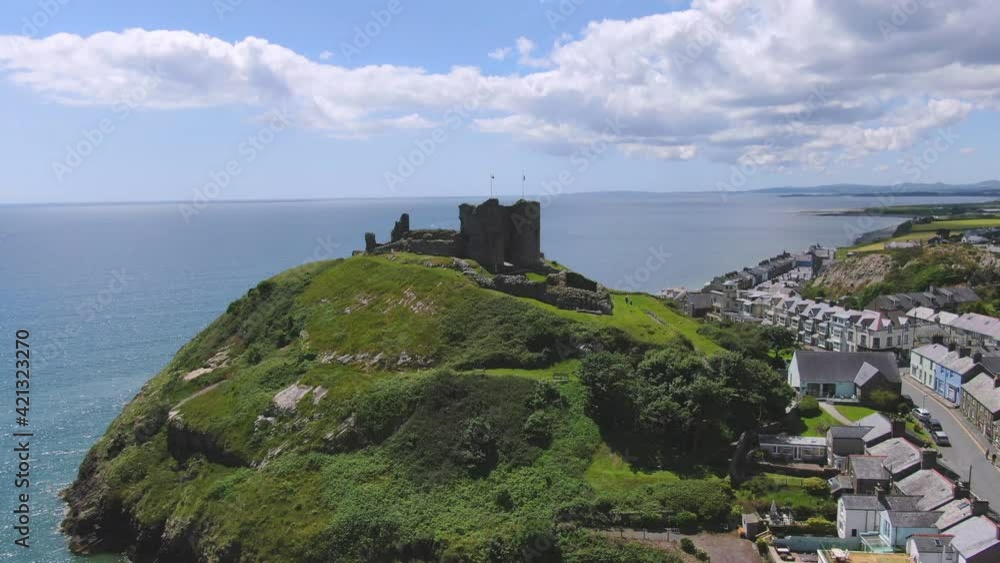 Welsh Coastal Castle on the Llyn Peninsula, North Wales. Aerial Reveal shot in 4k Welsh Coastal Castle on the Llyn Peninsula, North Wales. Aerial Reveal shot in 4k