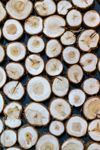 Round wood texture. The wall is faced with untreated wood.