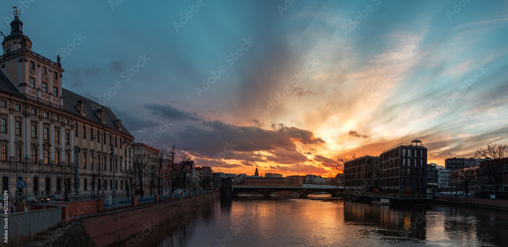 beautiful sunset over the river and the old city of wroclaw in poland