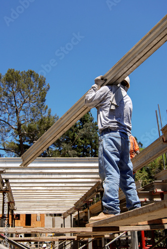 Wallpaper Mural Worker installing an aluminum I-beam support Torontodigital.ca