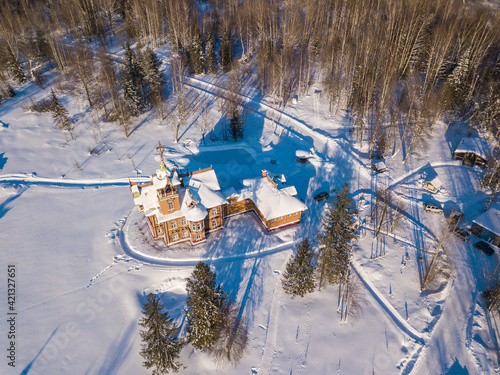 ASTASHOVO, RUSSIA - FEBRUARY 22, 2021: Aerial view of the beautiful restored wooden house (