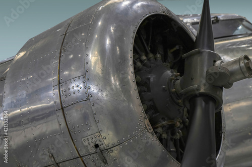 Tablou pe pânză Exterior view of early airliner radial engine, propeller, cowling, and cockpit ,