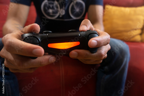 Man playing video games in the coach