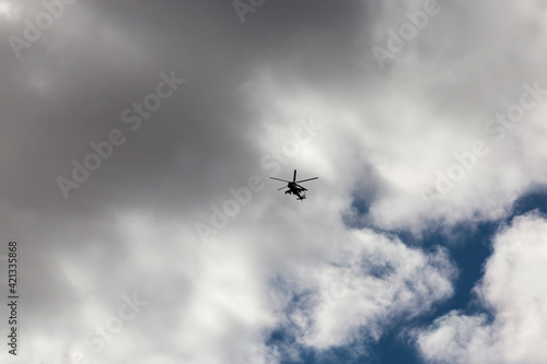 a helicopter flying in sky