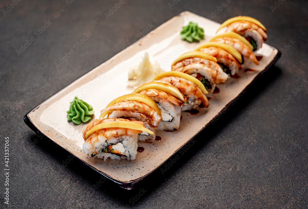 Japanese sushi rolls on a stone background Japanese sushi rolls on a stone background