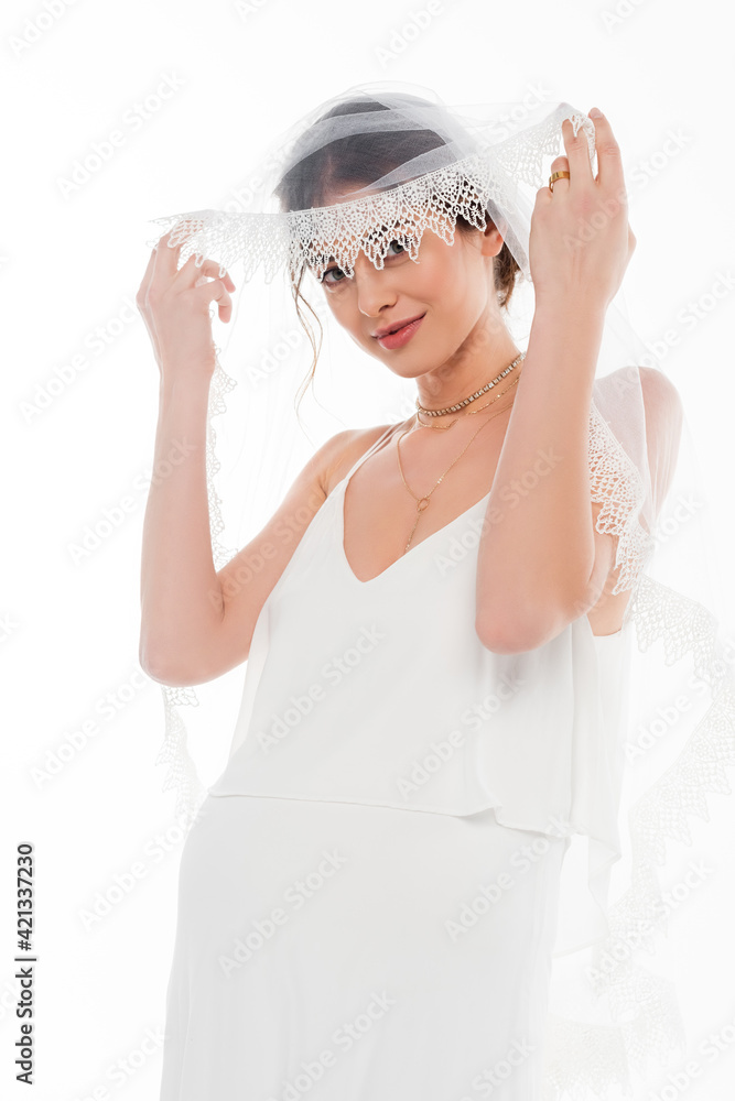 happy, pregnant woman in wedding dress and veil looking at camera isolated on white happy, pregnant woman in wedding dress and veil looking at camera isolated on white