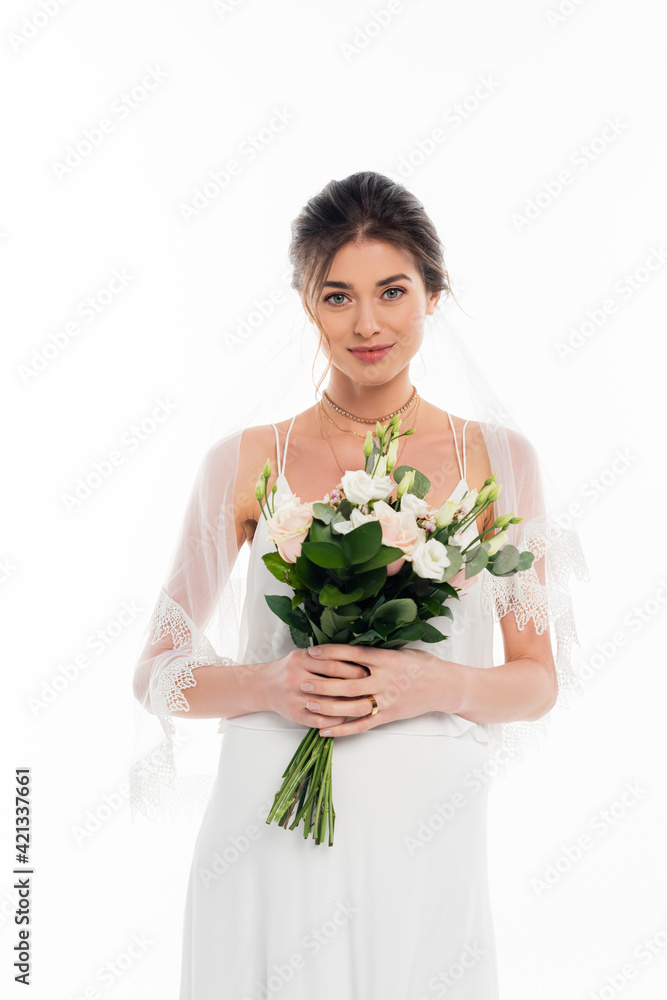 happy, pregnant bride looking at camera while holding wedding bouquet isolated on white happy, pregnant bride looking at camera while holding wedding bouquet isolated on white