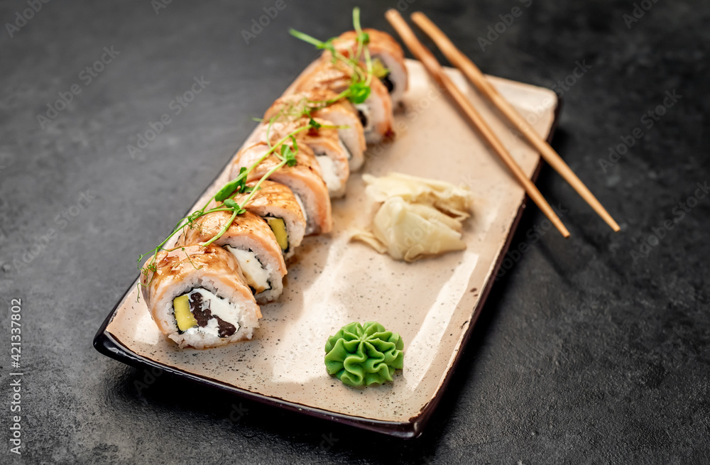 delicious sushi rolls on a stone background delicious sushi rolls on a stone background