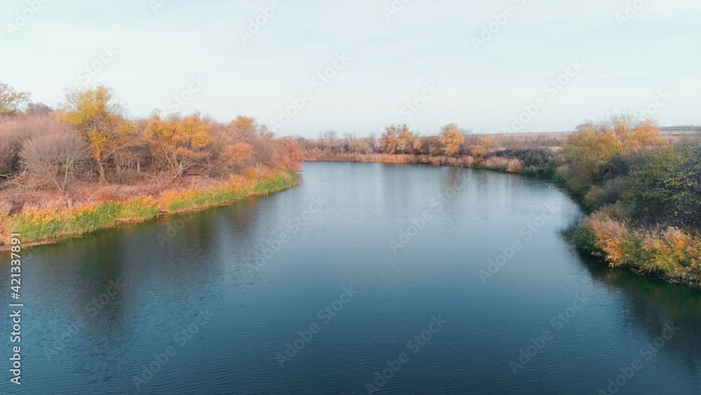 aerial view of river and beautiful russian countryside during Autumn. View of Autumn color forrest,aerial view over colorful trees, on a sunny fall day. Autumn aerial drone top view. aerial view of river and beautiful russian countryside during Autumn. View of Autumn color forrest,aerial view over colorful trees, on a sunny fall day. Autumn aerial drone top view.